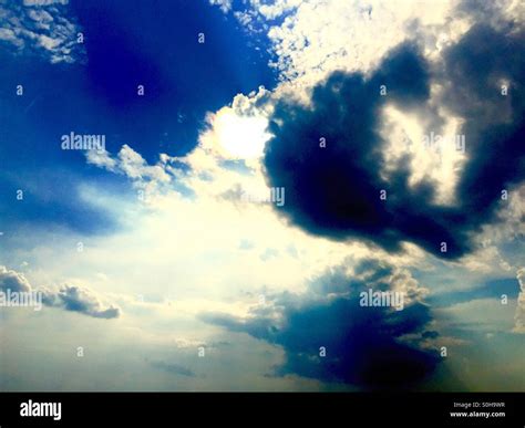 Light shines through the clouds Stock Photo - Alamy