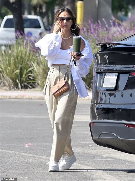 Jessica Alba Gives A Peek At Her Toned Midriff In White Crop Top