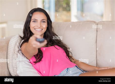 Pretty Brunette Relaxing On The Couch Stock Photo Alamy