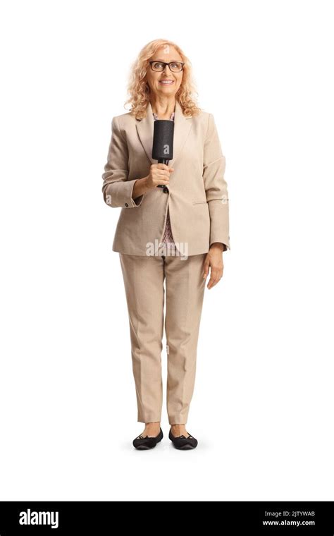 Full Length Portrait Of A Female Tv Host With A Microphone Isolated On