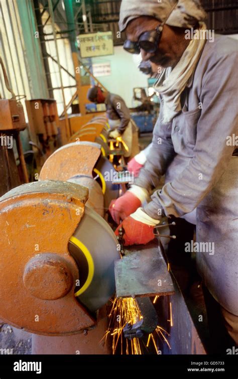 Workers at a factory Stock Photo - Alamy