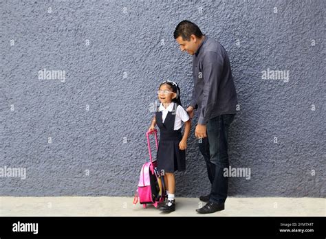 Divorced Single Dad Walks To School With His Year Old Brunette Daughter Carrying Her Backpack
