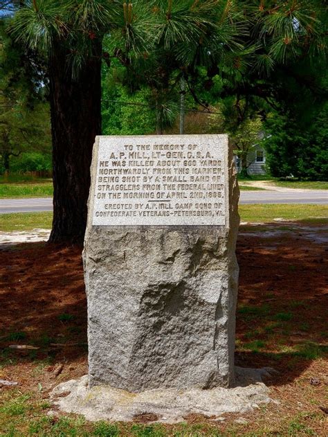 A Large Rock Sitting In The Middle Of A Park