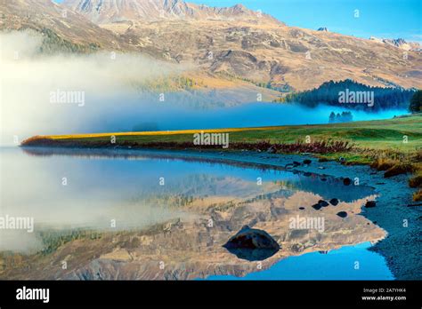 Mountain Lake At Sunrise In Autumn Landscape With Lake Gold Sunlight