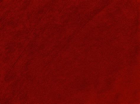 Dark red velvet fabric texture used as background. Empty dark red ...