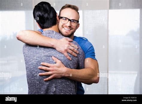 Smiling Gay Couple Embracing Stock Photo Alamy