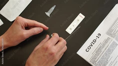 Stockvideon Rapid test covid 19. Test cassette and a kit of reagents ...