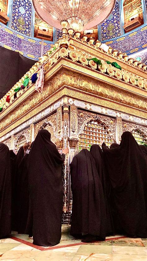 Three Monks In Black Robes Stand At The Base Of A Golden Structure With