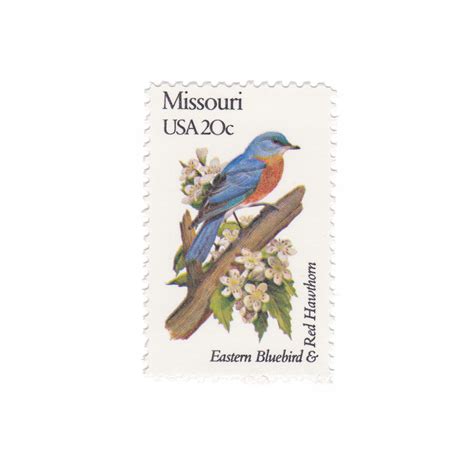 A Postage Stamp With A Blue Bird Sitting On Top Of A Tree Branch And