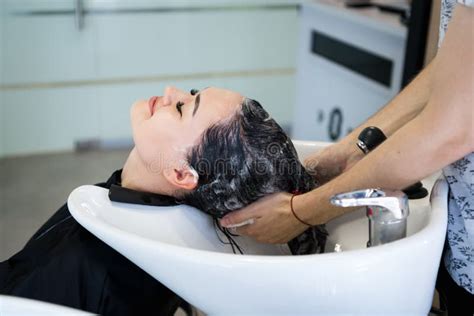 Beautiful Brunette Girl Washing Her Hair In The Hairdresser S Stock Image Image Of Beautiful