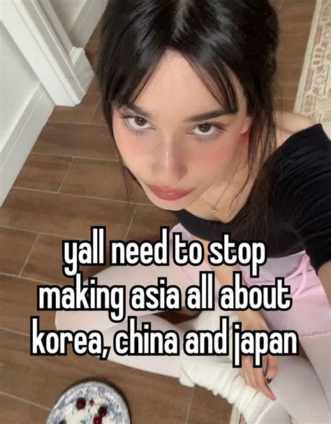 A Girl Sitting On The Floor Next To A Plate With Food In Front Of Her