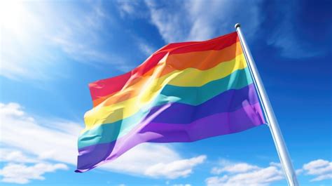 Premium Photo Gay Pride Flag Waving In The Wind Against Blue Sky Rainbow Flag Closeup D Rendering