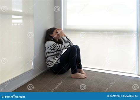 Sad Woman Sits In The Corner Stock Photo Image Of Crying Female