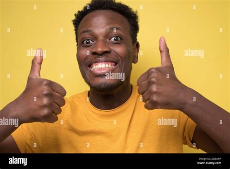 Portrait Of Happy African American Handsome Man Laughing And Showing