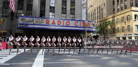 New Yorks Radio City Rockettes Perform On 6th Avenue In Front Of