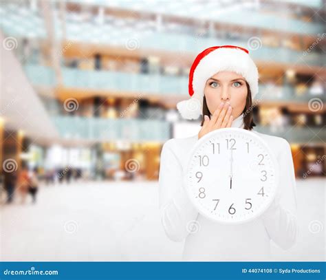 Woman In Santa Helper Hat With Clock Showing 12 Stock Photo Image Of