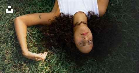 Woman In White Tank Top Lying On Green Grass Photo Free Plant Image