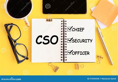 Cso Chief Security Officer Text On Notepad And Office Accessories On