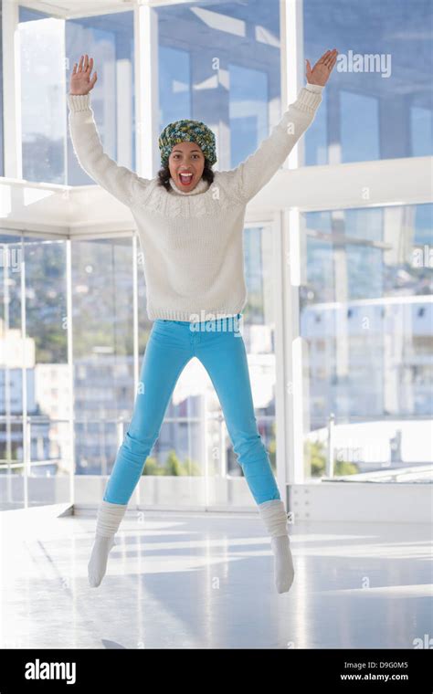 Portrait Of An Excited Woman Jumping Stock Photo Alamy