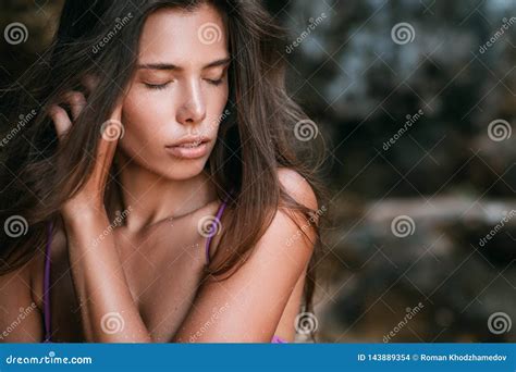 Close Up Portrait Of Beautiful Brunette Girl With Long Hair And Nude Make Up Stock Photo Image