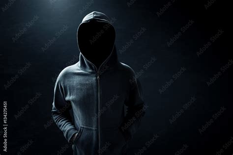 Hacker standing alone in dark room Stock Photo | Adobe Stock