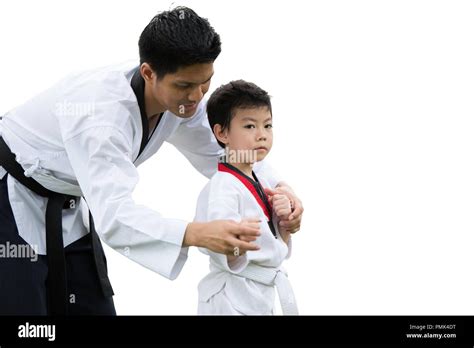 Taekwondo Master Black Belt Teaching Kid To Fight Guard On White