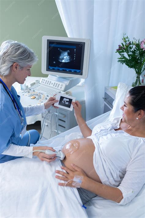 Premium Photo Doctor Doing Ultrasound Scan For Pregnant Woman In The