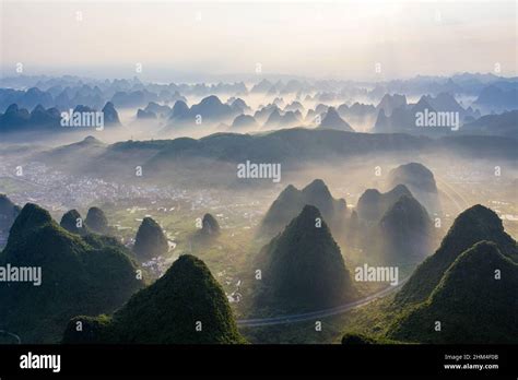 South of guilin karst landform morning mist sunrise scene Stock Photo ...