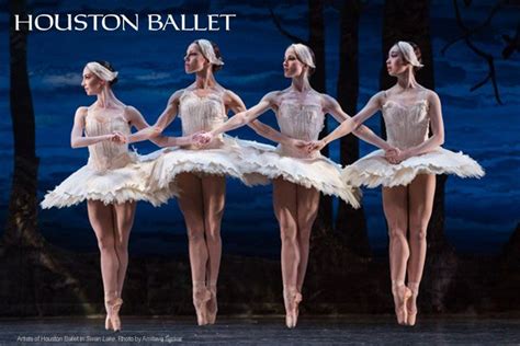 Four Ballerinas In White Tutus Are Standing Together