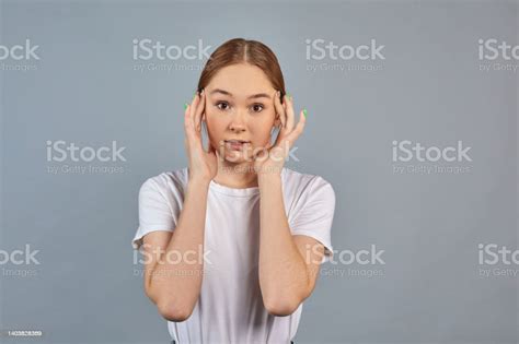 Shocked Amused Girl Standing Stunned Surprised Reacting On Gray