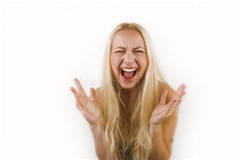 Angry Blonde Girl In Casual T Shirt Raising Hand Furious At Camera Rage And Aggressive Concept