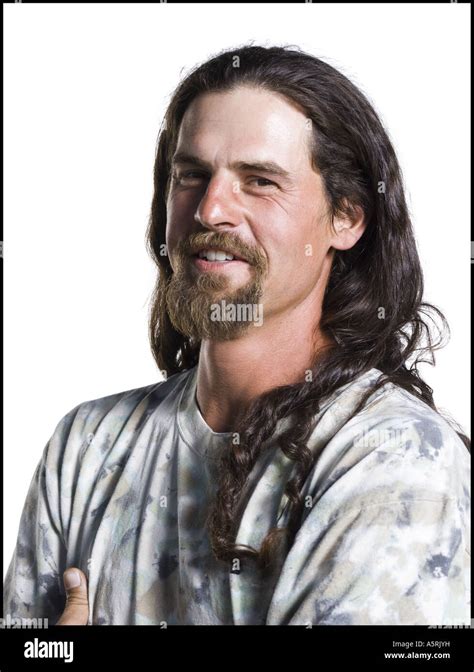 Man with long hair and a goatee Stock Photo - Alamy