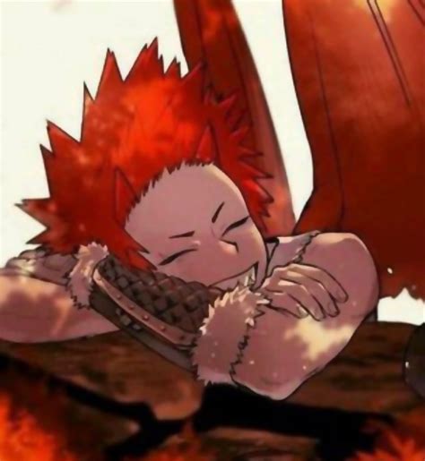 An Anime Character With Red Hair Is Laying On The Ground And Holding