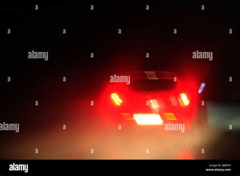 Night road in rain Stock Photo - Alamy