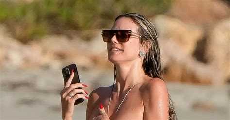 Heidi Klum Poses Topless And Dons Teeny Thong As She Snogs Hubby In