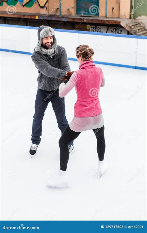 Romantic Couple Ice Skating Stock Image - Image of male, couple: 129717603