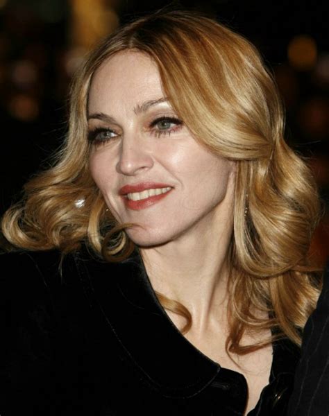 Madonnas Multi Toned Blonde Hair Styled In Coiled Curl