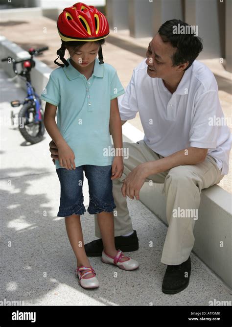 Mature Man Talking To His Granddaughter Stock Photo Alamy