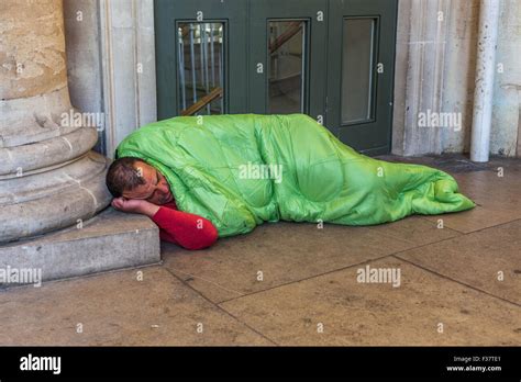 Homeless Man Sleeping Rough In A Sleeping Bag London England UK Stock