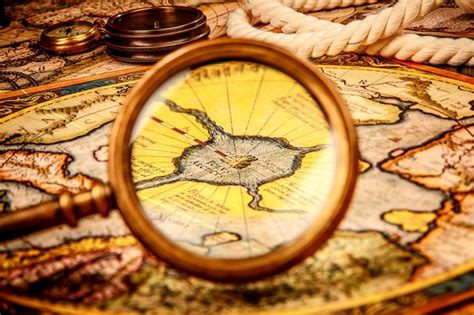 Premium Photo Vintage Magnifying Glass Lies On The Ancient Map Of The