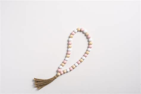 Wholesale Pink Natural White Wood Beaded Loop With Tassel Ganz