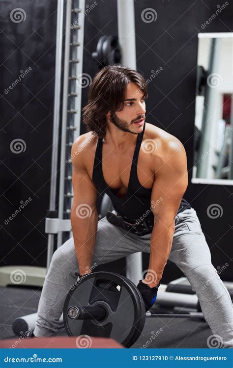 Muscular Bearded Man With Sexy Body Holds Big Bag Suitcase Royalty