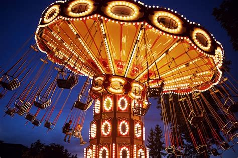 Premium Photo Carousel Merry Go Round In Amusement Park At Night City