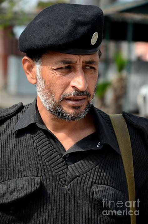 Portrait Of Pathan Police Officer In Grey Sweater And Police Beret Hat