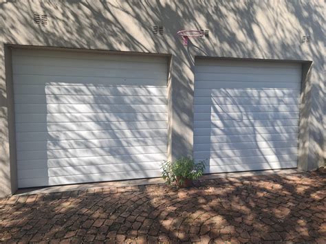 Single White Slatted Aluzinc Garage Door Nu Ray Doors