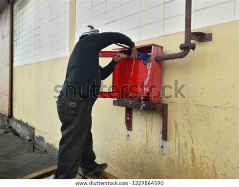 Male Workers Repairing Fire Hose Damaged Stock Photo 1329864590