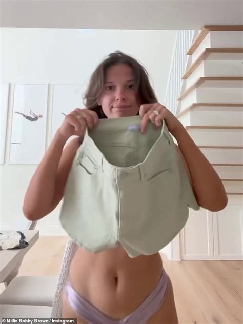Millie Bobby Brown Shows Off Her Sensational Figure In A Purple Bikini And Green Shorts As She