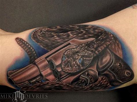 Snake And Gun Tattoo by Mike DeVries: TattooNOW