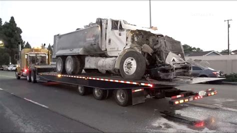 Dump Truck Plunges Off Freeway Into Apartment Building Killing 1