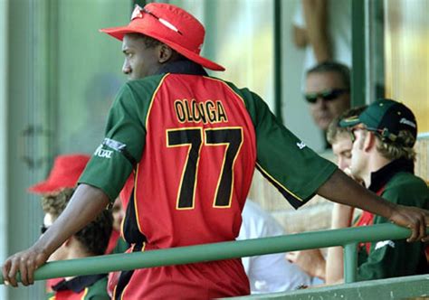 Henry Olonga wears a black armband in protest while in the players ...